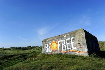 Old bunker in the dunes, with the graffiti "Be Free", Fano island, Denmark, Scandinavia, Europe