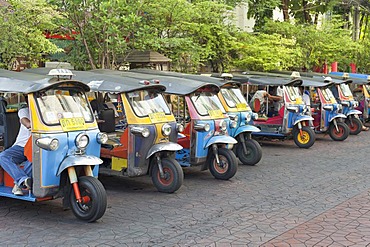 Line-up of auto rickshaws or tuk-tuks in Soi Rambutri, Bangkok, Thailand, Asia