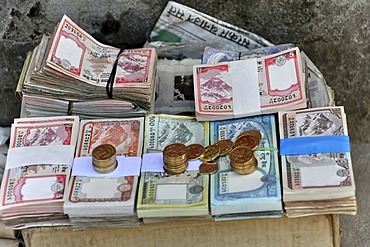 Banknotes on a street vendor's stall, Kathmandu, Kathmandu Valley, Nepal, Asia