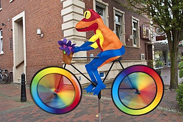 Weatherman "frog" on a bike, wind chimes, Papenburg, Lower Saxony, Germany, Europe