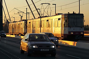 Public transport and private vehicles, tram and cars, on the Rheinkniebruecke Bridge over the Rhine River, Duesseldorf, North Rhine-Westphalia, Germany, Europe