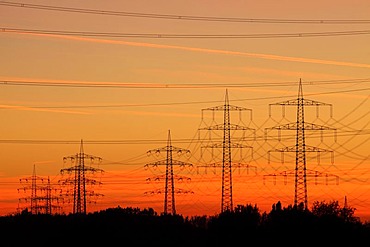 High voltage transmission lines, power lines, sunset, between Essen, Bottrop and Oberhausen, North Rhine-Westphalia, Germany, Europe