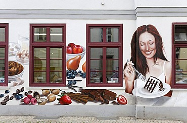 Woman eating cake, mural painting on a confectionery, Erfurt, Thuringia, Germany, Europe, PublicGround