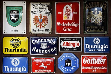 Collection of old tin signs of German and Austrian insurance companies