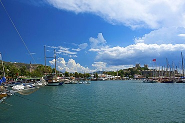 Gulet boats in the marina and St. Peter's castle in Bodrum, Turkish Aegean Coast, Turkey