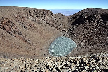 Frozen crater lake, volcanic crater of the Licancabur volcano, 5800m altitude, highest lake in the world, Licancabur, Andes mountain range, Altiplano, border of Chile and Bolivia, South America