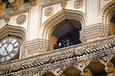 Muslim women waving down from the Charminar monument, Hyderabad, Andhra Pradesh, India, Asia