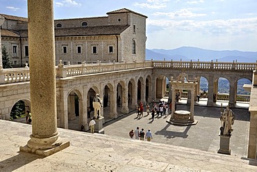 Cloister of Bramante with cistern and statues of St. Benedict and St. Scholastica, Benedictine abbey of Montecassino, Monte Cassino, Cassino, Lazio, Italy, Europe