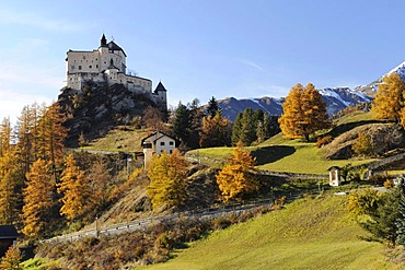 Tarasp Castle in an autumn-coloured landscape, Scuol, Lower Engadin, Grisons, Switzerland, Europe