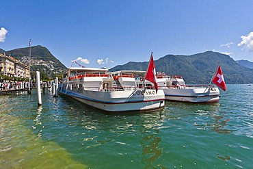 Excursion boats at the dock in Lugano, Lake Lugano, Lago di Lugano, Ticino, Switzerland, Europe