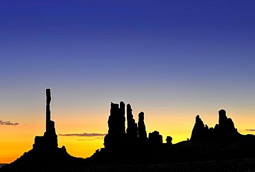 Totem Pole and Yei Bi Chei rock formations, silhouetted before sunrise, dawn, Monument Valley, Navajo Tribal Park, Navajo National Reservation, Arizona, Utah, USA