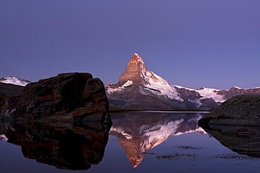 Mt Matterhorn before sunrise, reflection in Stellisee Lake with visible umbra, Zermatt, Canton Valais, Switzerland, Europe, PublicGround