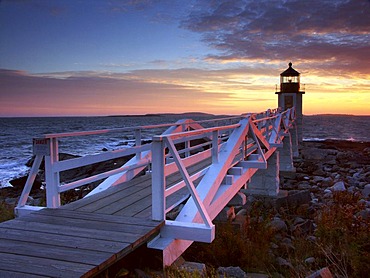 Spectacular sunset behind Marshall Point Lighthouse in Port Clyde, Maine, USA