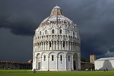 The Baptistry at the Piazza del Duomo or Piazza dei Miracoli, Square of Miracles, against dark clouds, Pisa, Tuscany, Italy, Europe