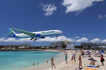 Air Caraibes aircraft landing over the beach of Saint Maarten, the island of Saint Maarten, Netherlands and France, Caribbean Sea