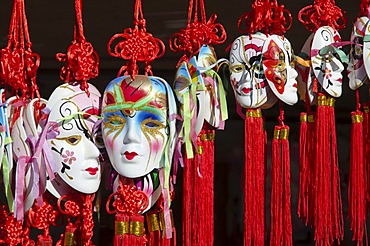 Beautiful masks for souvenir are sold in gift-shops outside of temples, Mysore, Karnataka, India, Asia