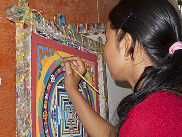 Painter painting a Thanka or Thangka painting, Boudnath, Kathmandu, Nepal, South Asia