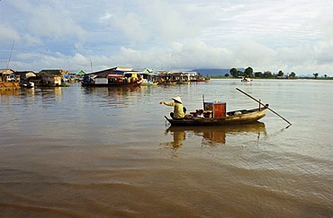 Boat transporting goods across the Tonle Sap River, Kampong Chhnang, Cambodia, Southeast Asia