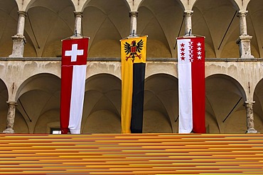 Flags of Switzerland, the municipality of Brig-Glis and the canton of Valais in the courtyard of the Stockalper Palace, Brig, Valais, Switzerland, Europe