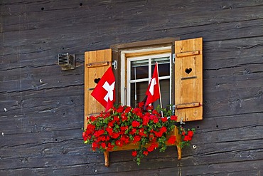 Window with Swiss flags, Zermatt, Canton Valais, Switzerland, Europe