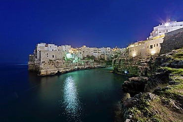 View of Polignano a Mare at night, Puglia region, also known as Apulia, Southern Italy, Italy, Europe