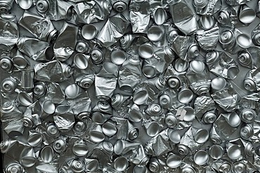 Empty, crushed spray cans, spray-painted in silver colour, in a shop window, Exeter, Devon, England, United Kingdom, Europe