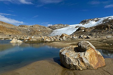 Lake and boulder on the Mittivakkat Glacier, Ammassalik Peninsula, East Greenland, Greenland