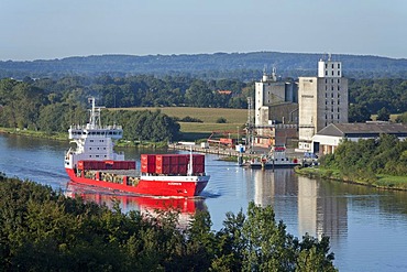 Container ship on the Kiel Canal near Schafstedt, Schleswig-Holstein, Germany, Europe