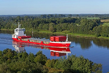 Container ship on the Kiel Canal near Schafstedt, Schleswig-Holstein, Germany, Europe