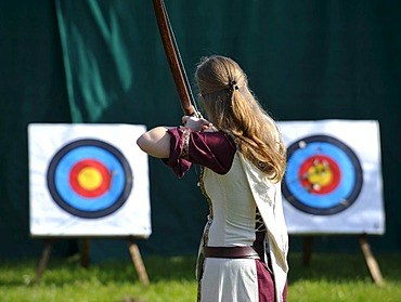 Woman wearing medieval clothes practising archery, Spectaculum, Maxlrain, Bavaria, Germany, Europe