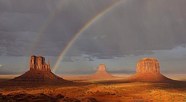 Double rainbow during a rain shower after a thunderstorm in the evening light, mesas, West Mitten Butte, East Mitten Butte, Merrick Butte, Monument Valley, Navajo Tribal Park, Navajo Nation Reservation, Arizona, Utah, United States of America, USA