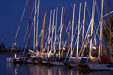 Port of Konstanz at night with a row of sailing ships, Internationale Bodenseewoche 2011 festival, Konstanz, Baden-Wuerttemberg, Germany, Europe