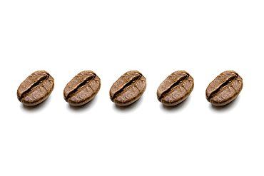 Coffee beans, identical, in a row