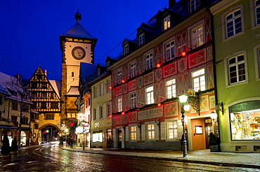 Wintery old town with Schwabentor city gate at Christmas time, Freiburg im Breisgau, Baden-Wuerttemberg, Germany, Europe