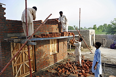 Construction of brick houses for families whose homes were destroyed during the flood catastrophe of 2010, Lashari Wala village near Muzaffaragarh, Punjab, Pakistan, Asia