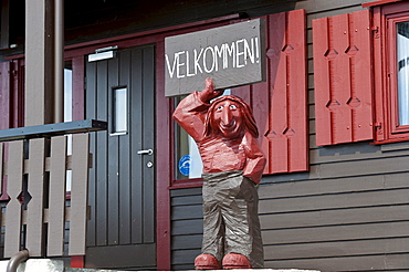 Troll figure holding a welcome sign, Hardangervidda mountain plateau, Norway, Scandinavia, Northern Europe