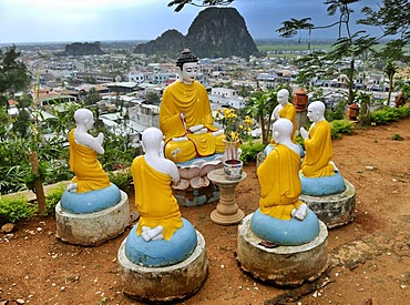 Buddha and praying monks, sculptures in front of Marble Mountains, Ngu Hanh Son, Thuy Son, Da Nang, Vietnam, Asia