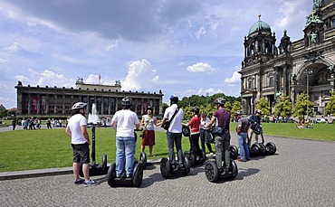 City tour for tourists riding Segways, in front of Berlin Cathedral, Supreme Parish and Collegiate Church in Berlin, and Altes Museum, Lustgarten pleasure garden, Museum Island, UNESCO World Heritage Site, Mitte district, Berlin, Germany, Europe, PublicGr