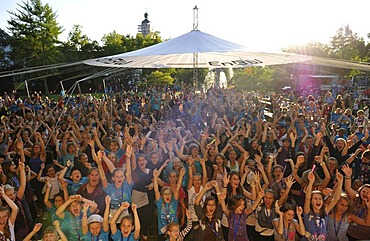 Audience, children and adolescents attending an open-air concert