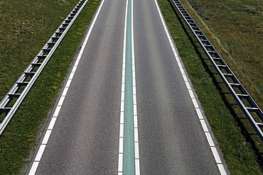 Street with a green median strip, traffic free, Veerse Dam between Walcheren and Noord-Beveland, Zeeland, Netherlands, Europe