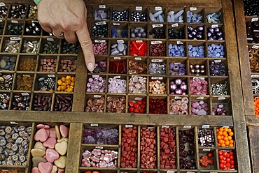 Colorful glass beads for sale in a type case, Flachsmarkt historical crafts market, Krefeld-Linn, North Rhine-Westphalia, Germany, Europe