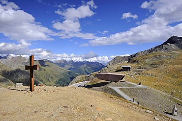 Summit cross above the crest of Timmelsjoch High Alpine Road, 2509m, Oetztal Valley, Tyrol, Austria, Europe