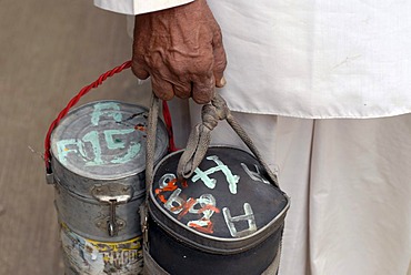 Dabba wallah or food deliverer with Dabbas or food containers marked with characters to allow correct delivery, Mumbai, India, Asia