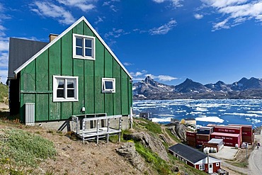 House painted in green colour, above the port, Tasiilaq, also known as Ammassalik, East Greenland, Greenland