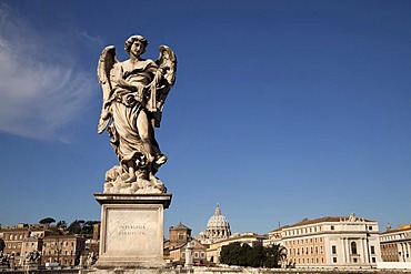 Angel by Bernini on the Ponte Sant'Angelo bridge and cityscape with St. Peter's Basilica in Rome, Lazio, Italy, Europe