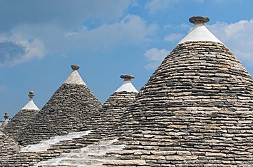 Group of Trulli, traditional Apulian stone dwellings with conical roofs and pinnacles, Alberobello, Bari province, Puglia region, Italy, Europe