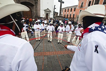 Male dance group on the edge of a procession, car-free Sunday in the historic centre of Quito, Ecuador, South America