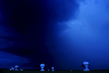 Raisting satellite earth station in front of a church at night, Raisting, Upper Bavaria, Germany, Europe