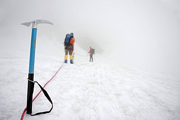 Ice pick with rope team on glacier, Chur, Canton Grisons, Switzerland, Europe