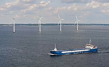 Cargo ship "Wilson Astakos" sailing in front of an offshore wind farm in the oresund outside Copenhagen, Denmark, Europe